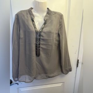 Gray sheer top with beaded neck detail